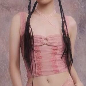 Pink lace type top with ribbon in back Size L